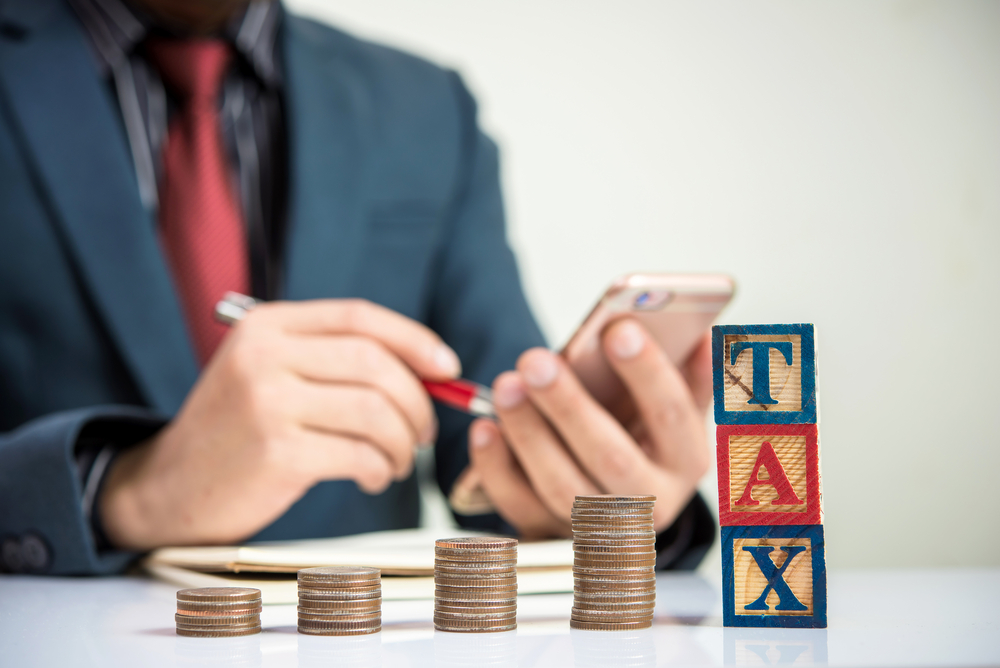 A person sitting at a table Description automatically generated