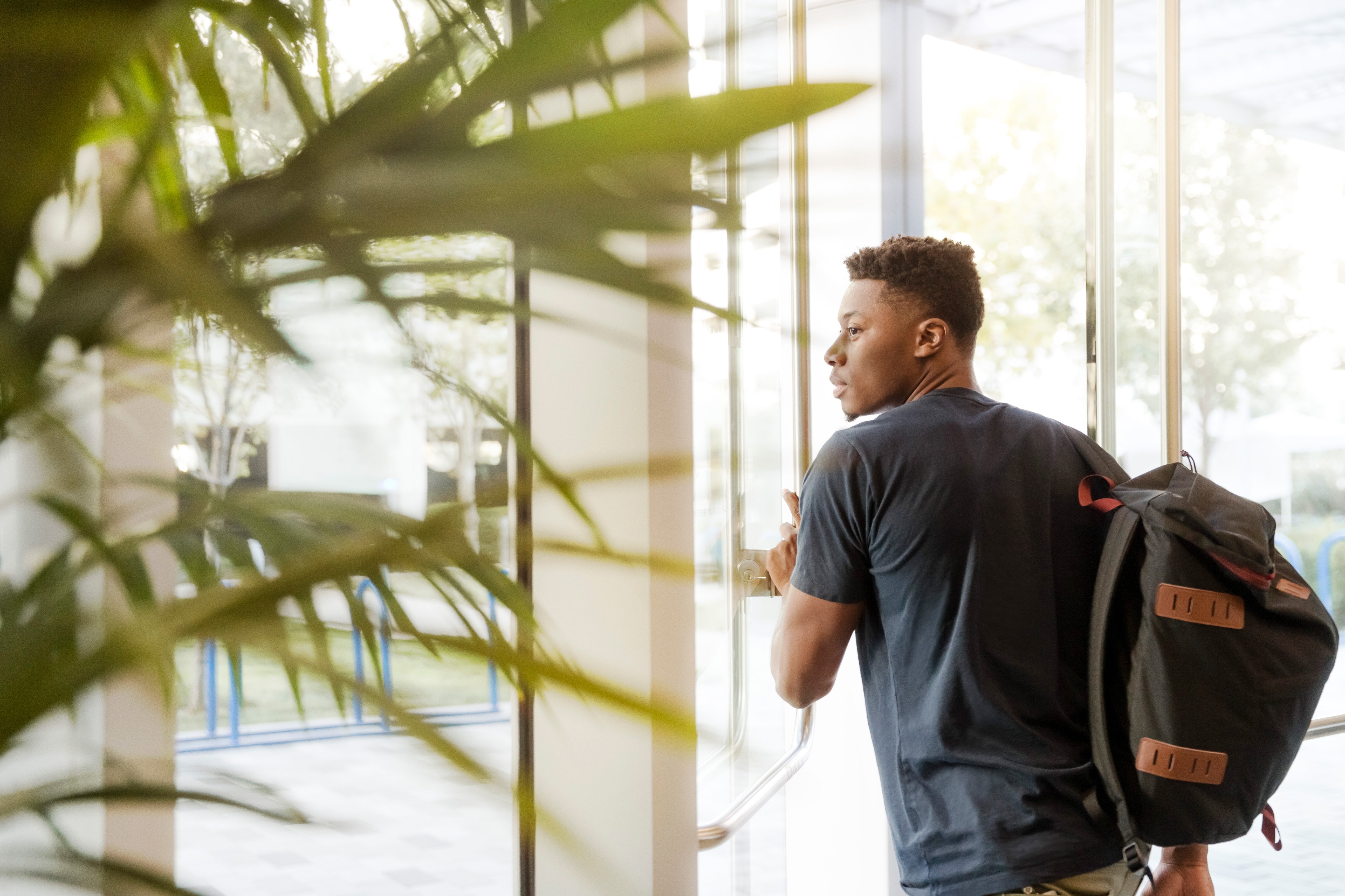 Different Types of Certificates College Students Should Know About Importance of Documents 1 man looking outside window carrying black and brown backpack 1251861