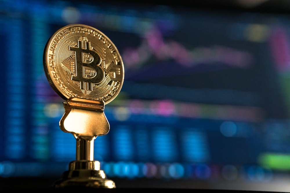 What Are the Benefits of Bitcoin as a Payment Option? 2 selective focus photo of Bitcoin near monitor