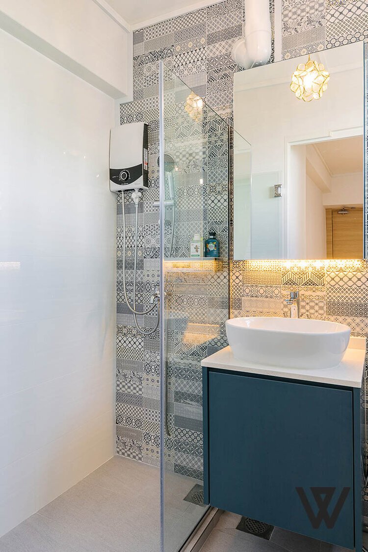 A bathroom with a glass shower Description automatically generated with medium confidence